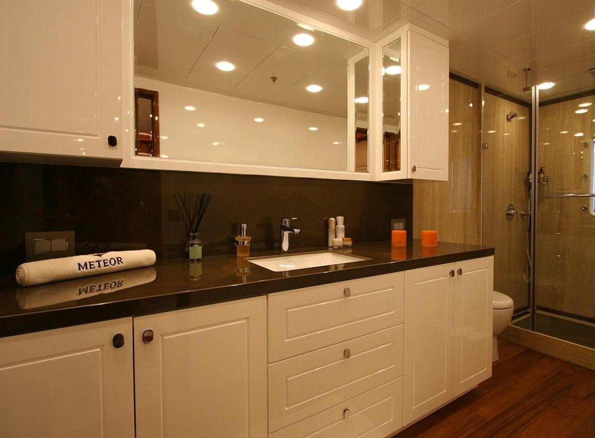a bathroom with a sink and a mirror aboard METEOR Yacht for Sale