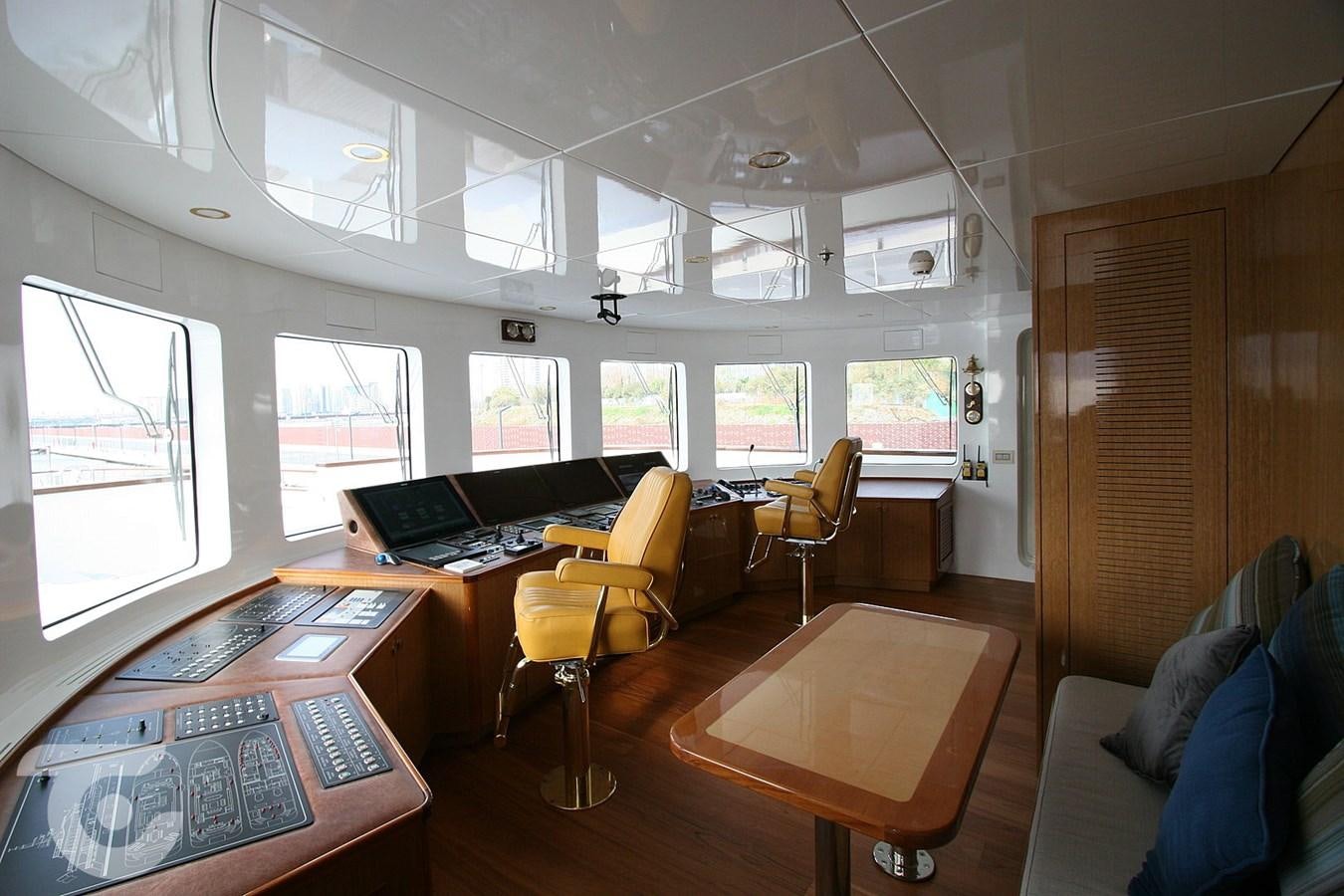 a room with a desk and chairs aboard METEOR Yacht for Sale