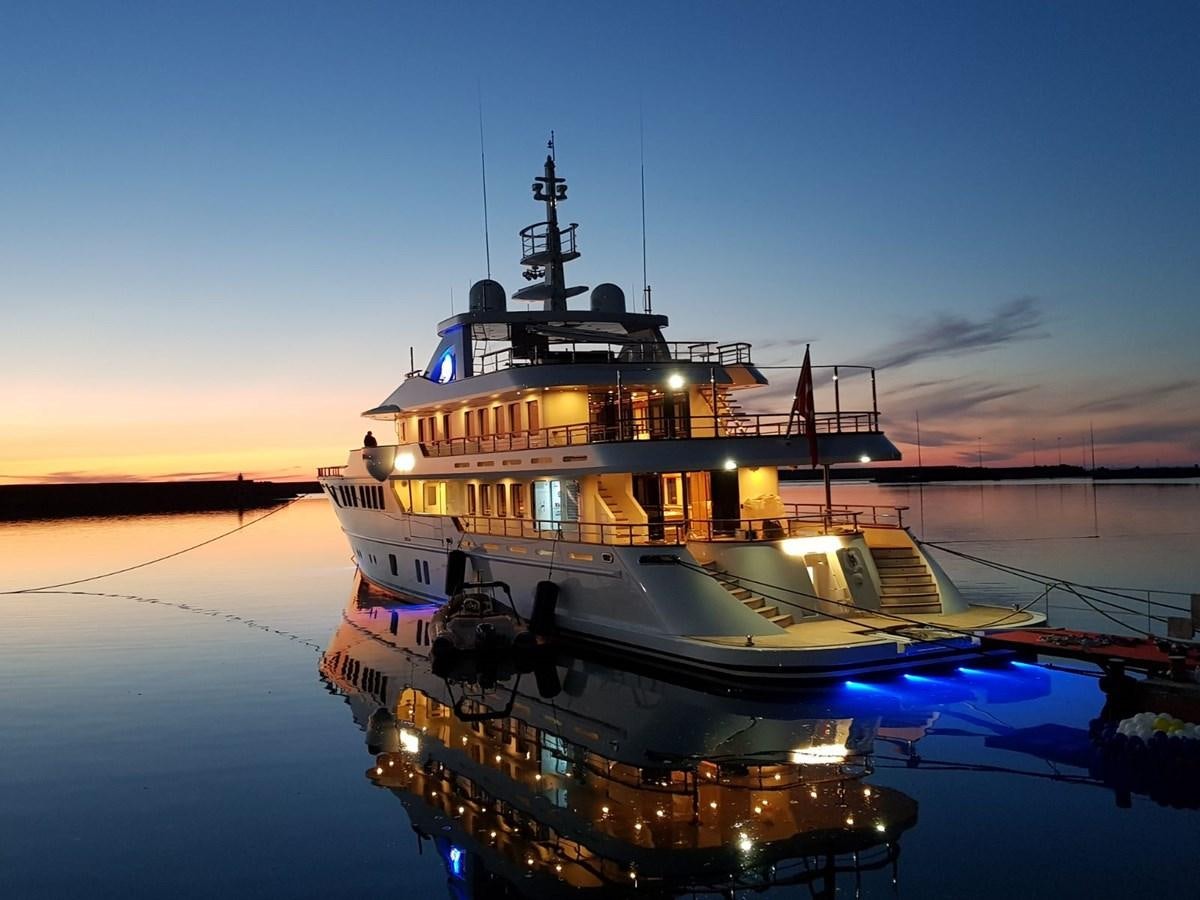 a large boat on the water aboard METEOR Yacht for Sale