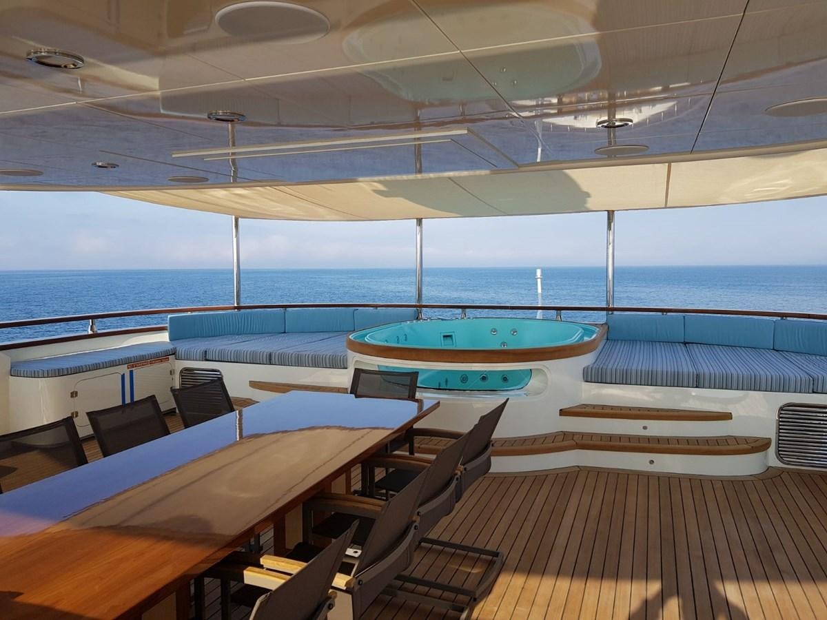 a pool with chairs and tables aboard METEOR Yacht for Sale