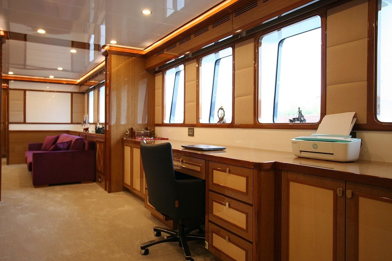 a room with a desk and a chair aboard METEOR Yacht for Sale