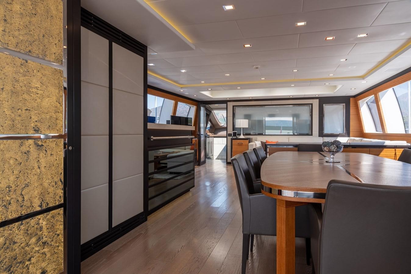 a room with a table and chairs aboard ASYA Yacht for Sale
