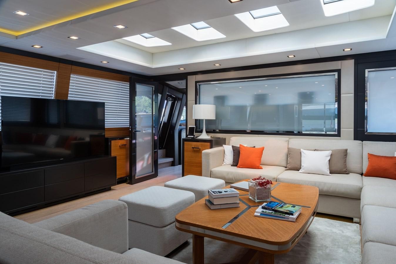 a living room with a large tv aboard ASYA Yacht for Sale