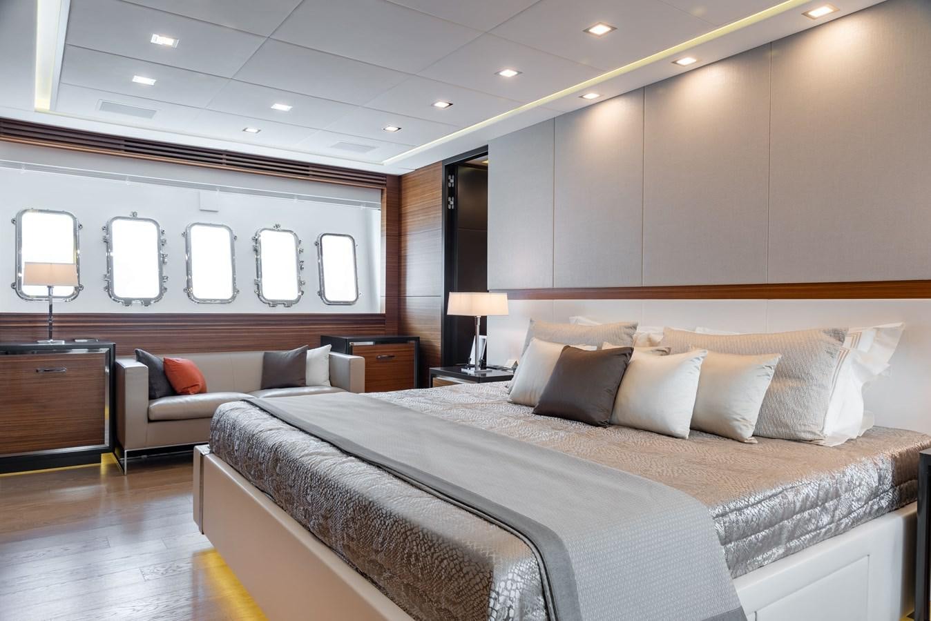 a hotel room with a bed and a couch aboard ASYA Yacht for Sale