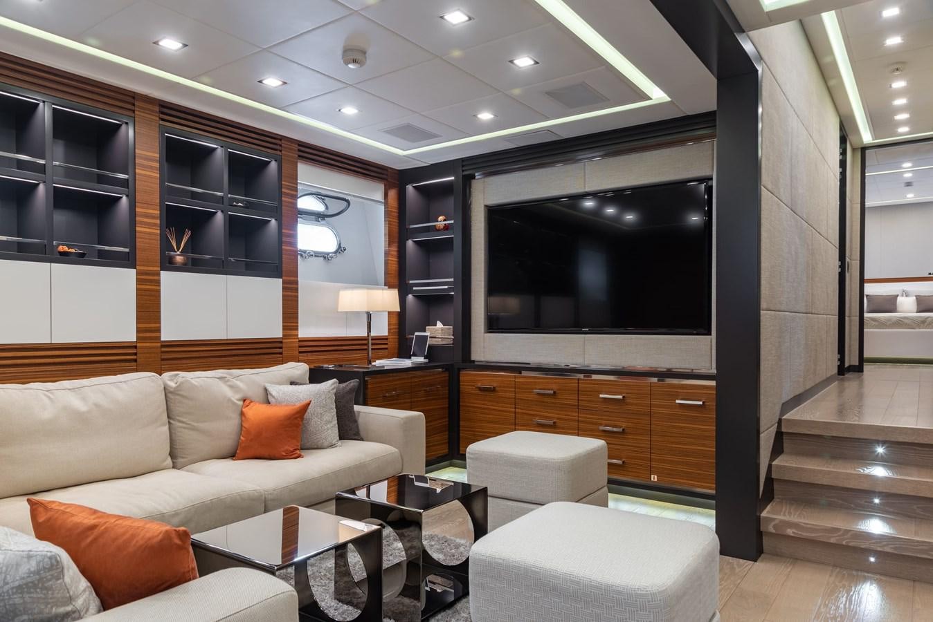 a living room with a large tv aboard ASYA Yacht for Sale