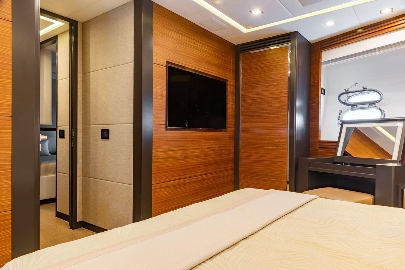 a room with a bed and a television aboard ASYA Yacht for Sale