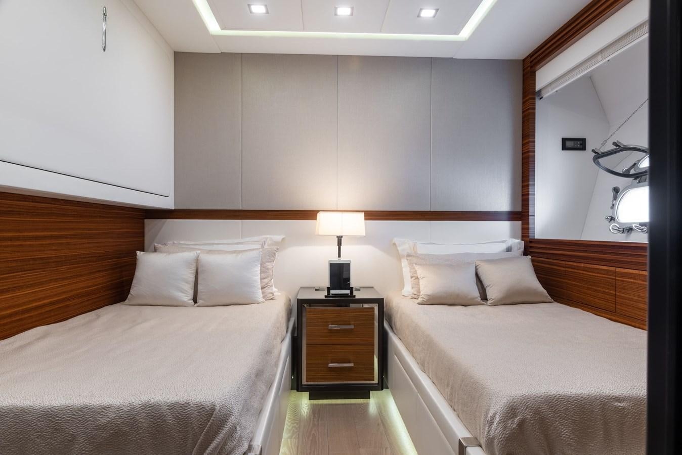 a room with two beds aboard ASYA Yacht for Sale