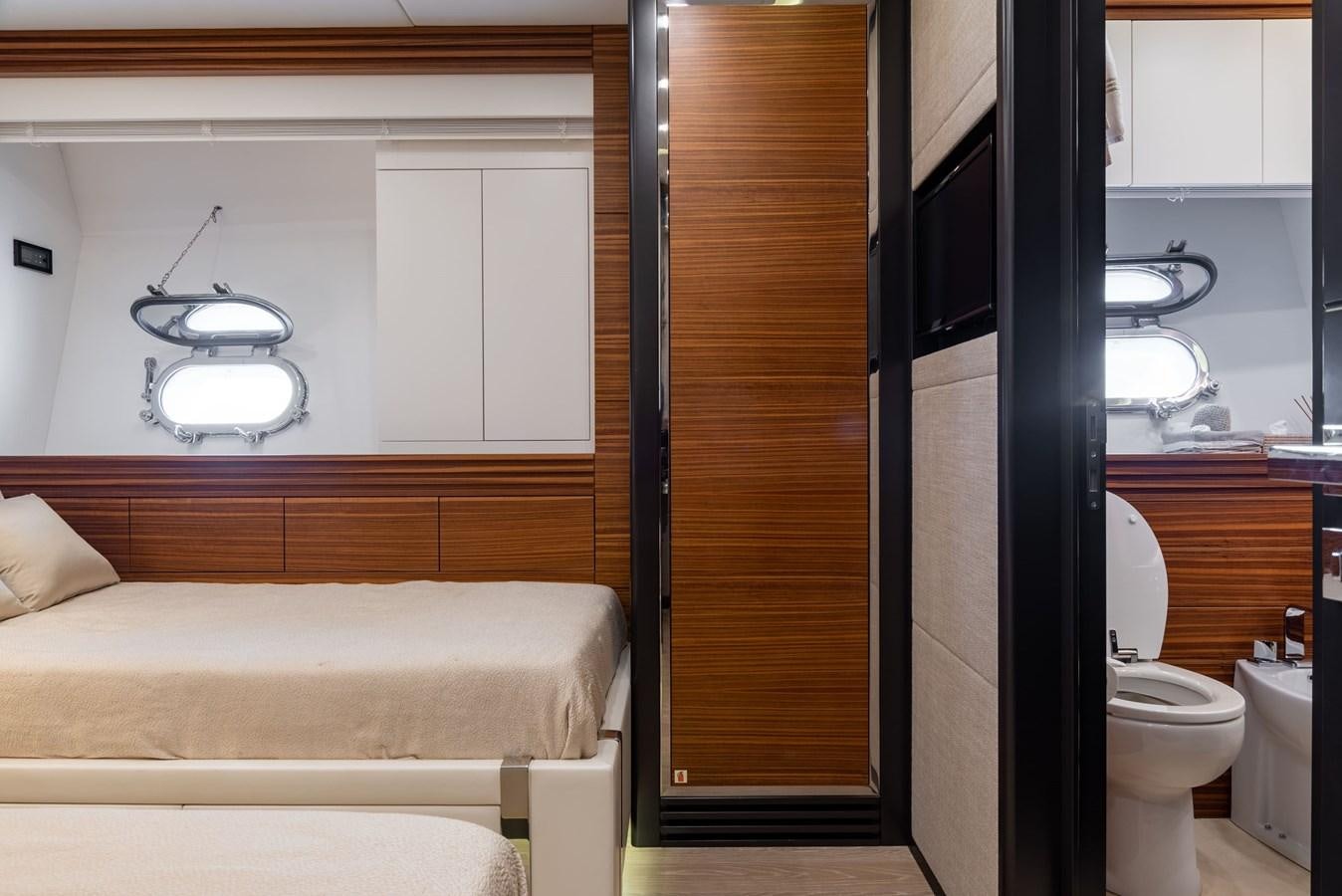 a bathroom with a bed and a mirror aboard ASYA Yacht for Sale