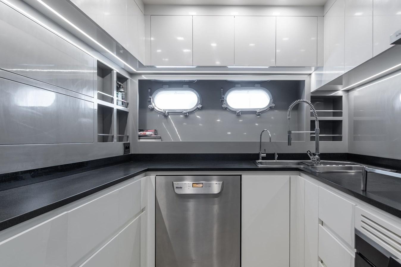 a kitchen with stainless steel appliances aboard ASYA Yacht for Sale