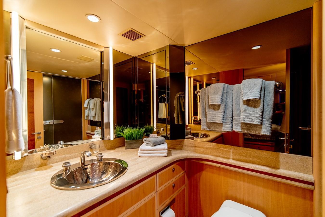 a bathroom with a large mirror aboard SHADOWFAX Yacht for Sale
