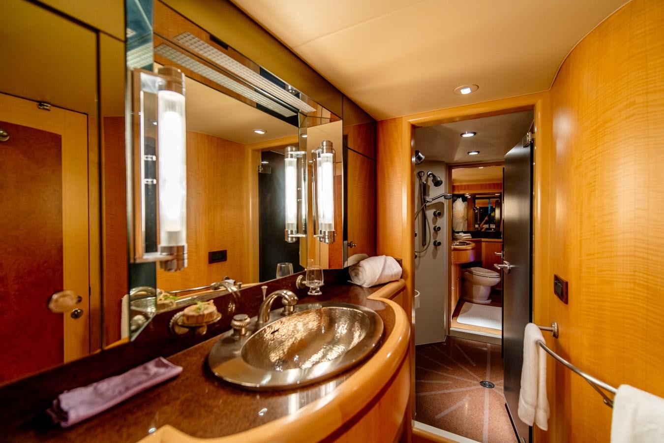 a bathroom with a sink and a mirror aboard SHADOWFAX Yacht for Sale