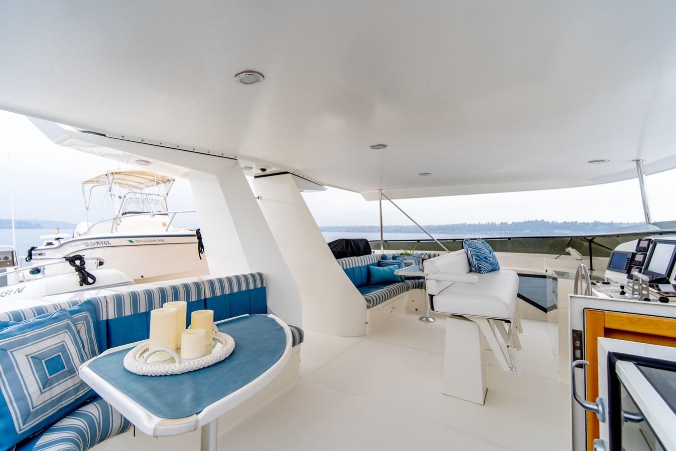 a boat with a table and chairs aboard SHADOWFAX Yacht for Sale