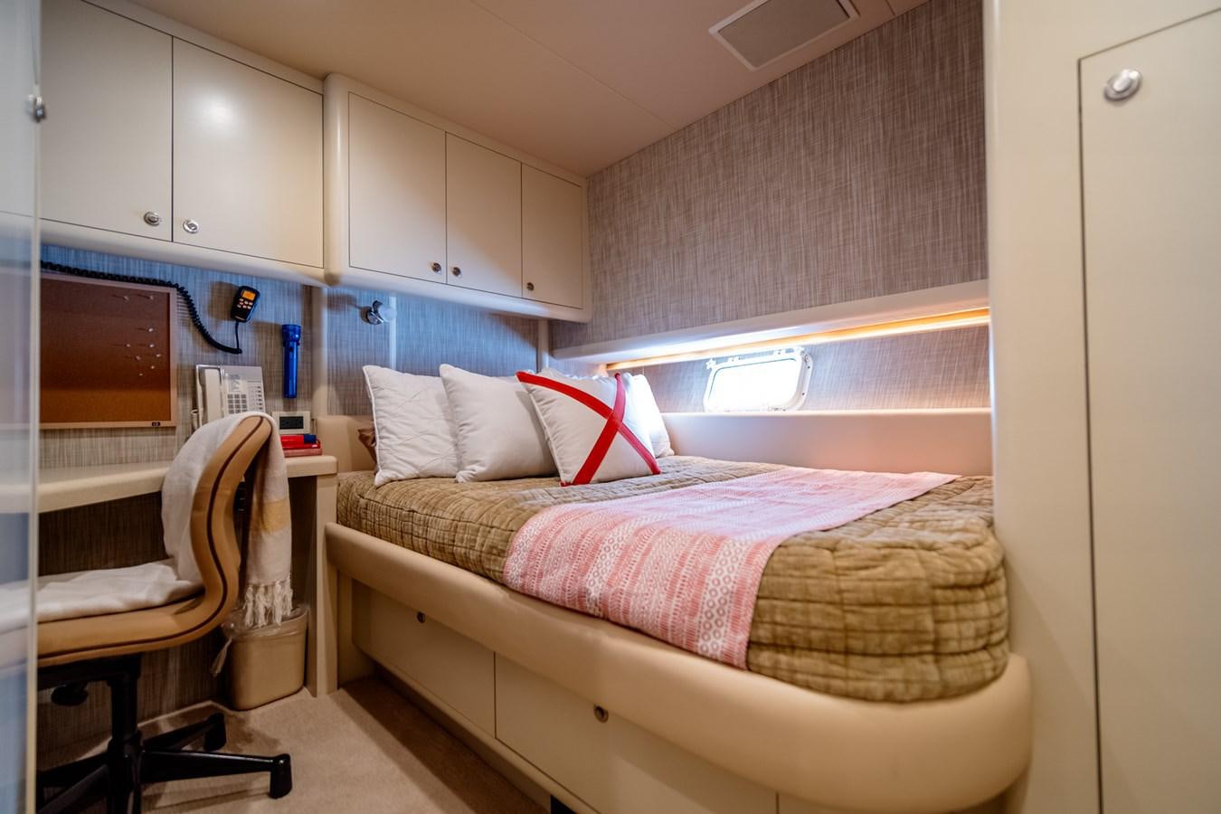 a small bedroom with a bed aboard SHADOWFAX Yacht for Sale