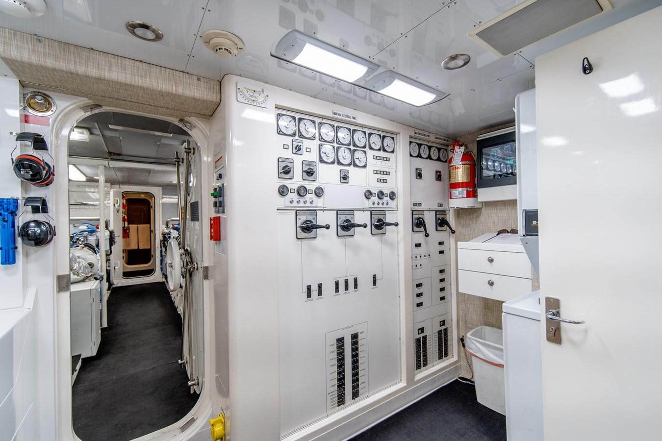 a long hallway with white cabinets aboard SHADOWFAX Yacht for Sale
