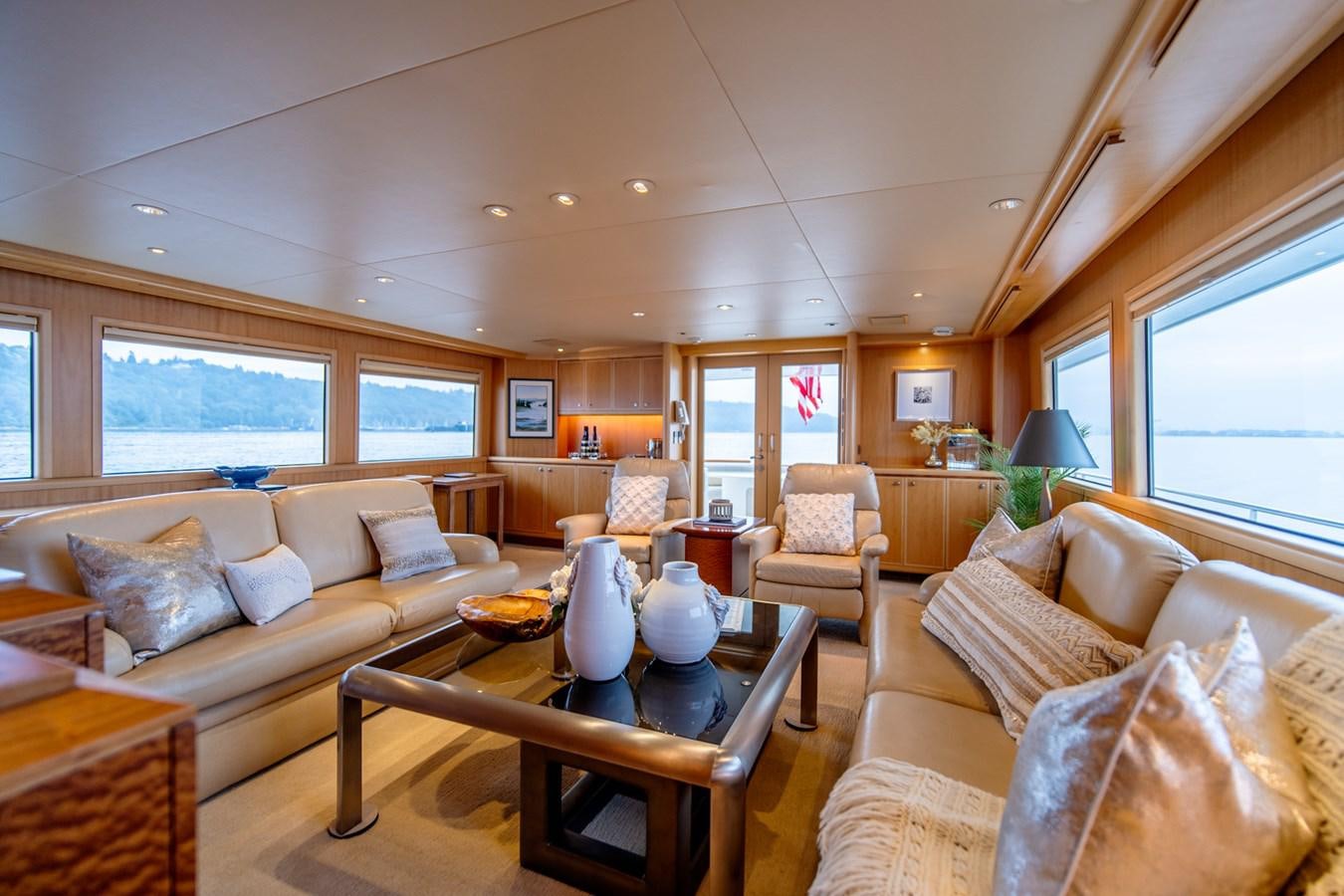 a living room with a table and couches aboard SHADOWFAX Yacht for Sale