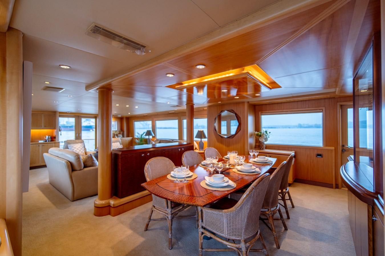 a dining room with a table and chairs aboard SHADOWFAX Yacht for Sale