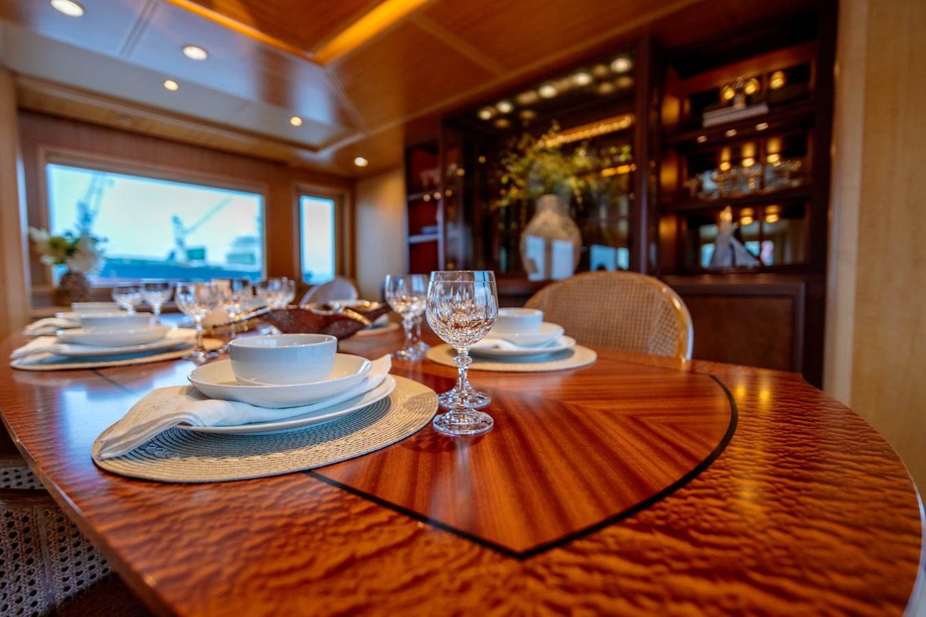 a table with plates and glasses on it aboard SHADOWFAX Yacht for Sale