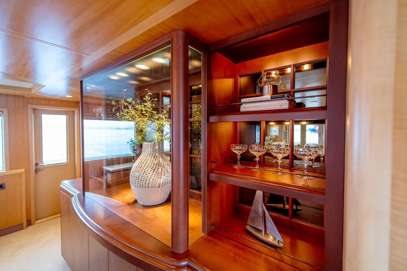 a room with a glass vase and a television aboard SHADOWFAX Yacht for Sale