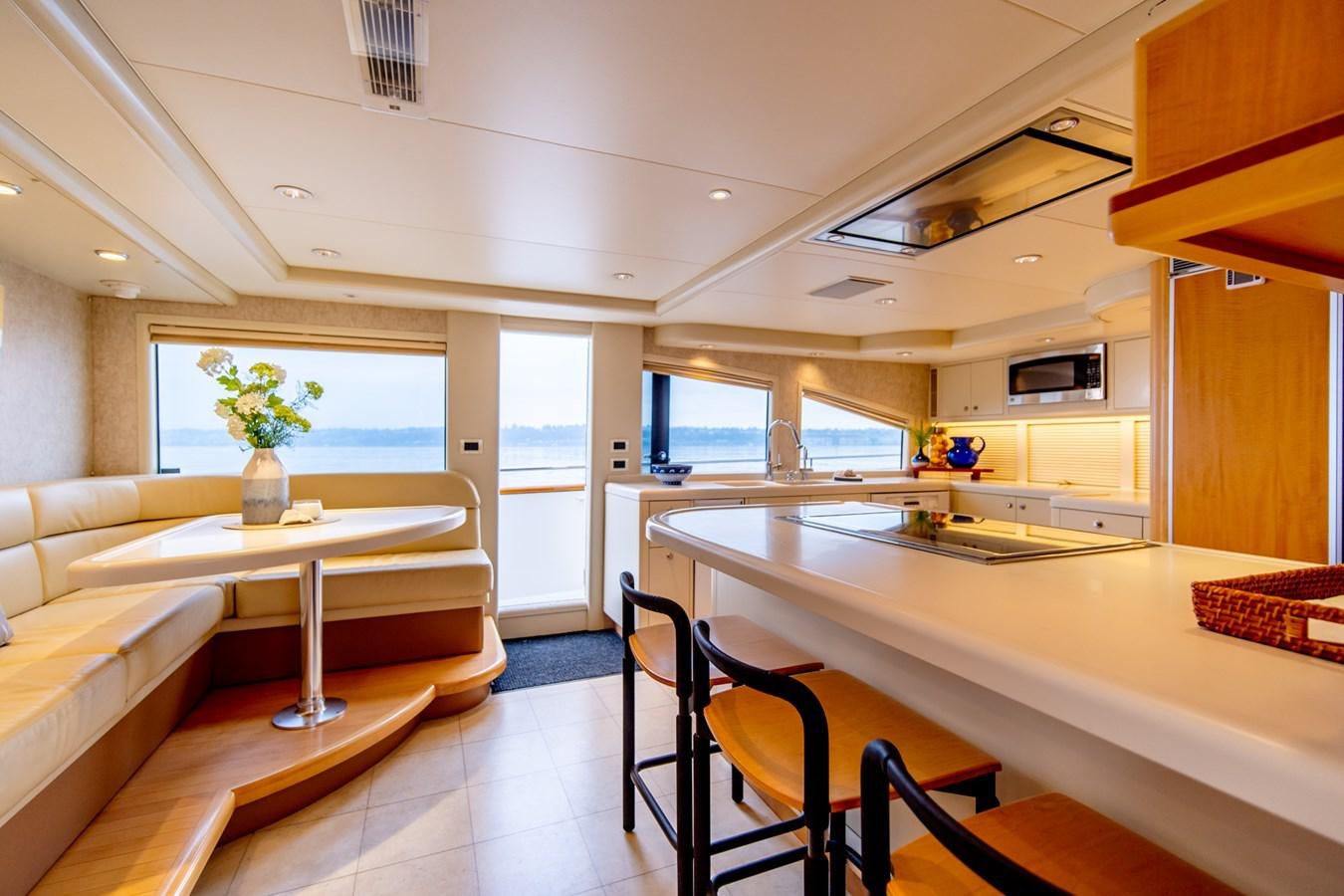 a room with a table and chairs aboard SHADOWFAX Yacht for Sale