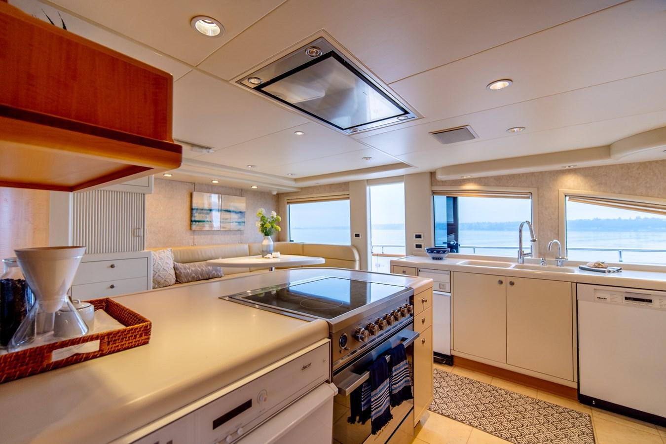 a kitchen with a stove and cabinets aboard SHADOWFAX Yacht for Sale