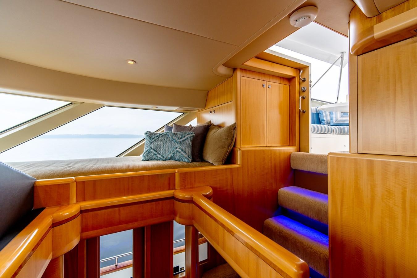 a wooden cabin with a bed aboard SHADOWFAX Yacht for Sale