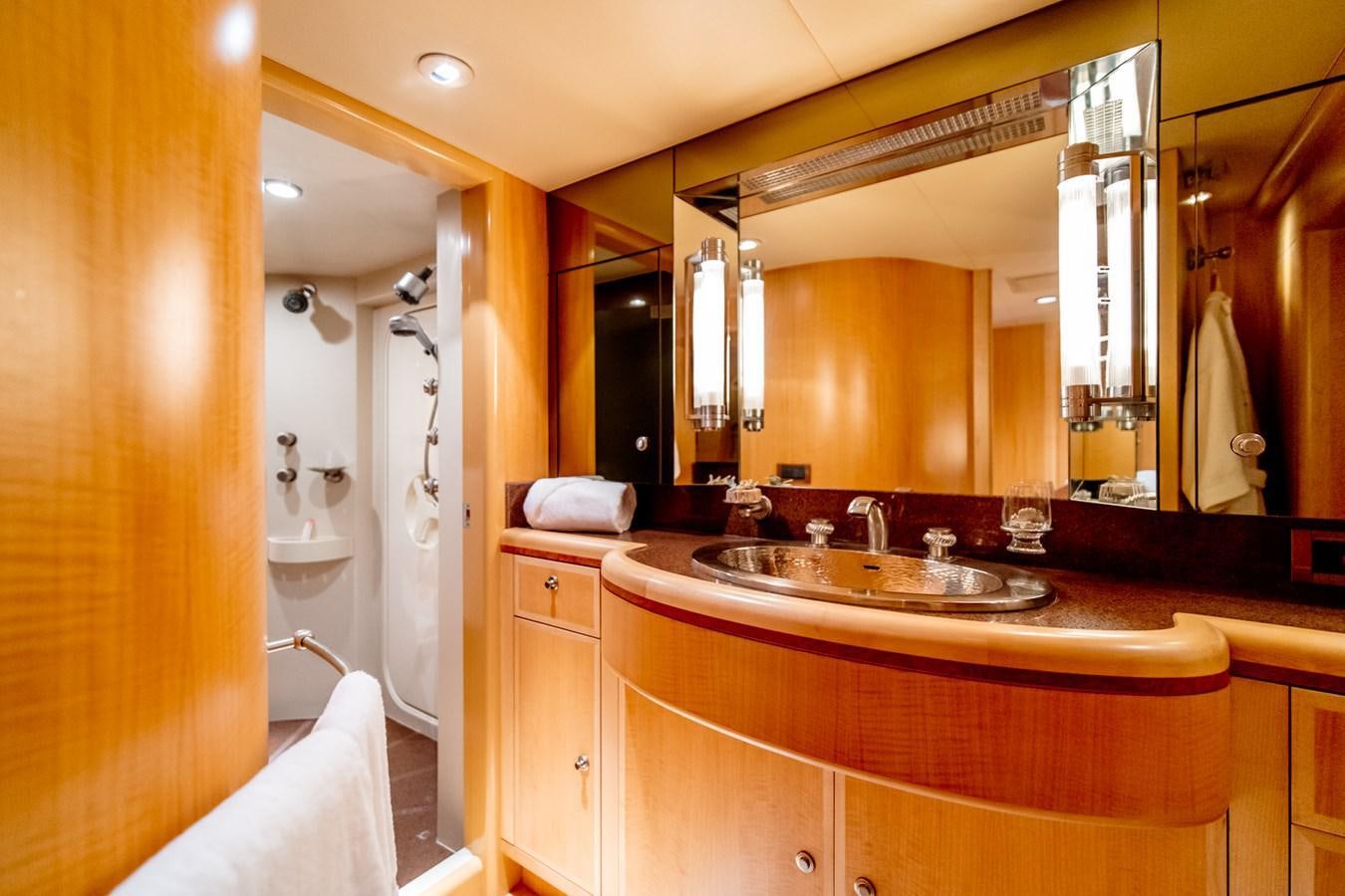 a bathroom with a large mirror aboard SHADOWFAX Yacht for Sale