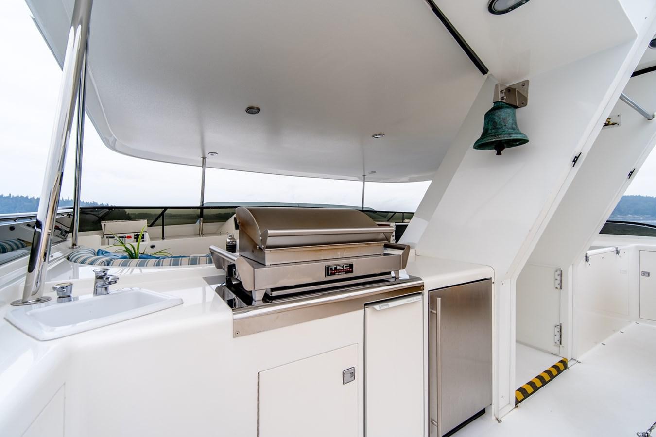a white kitchen with a large sink aboard SHADOWFAX Yacht for Sale