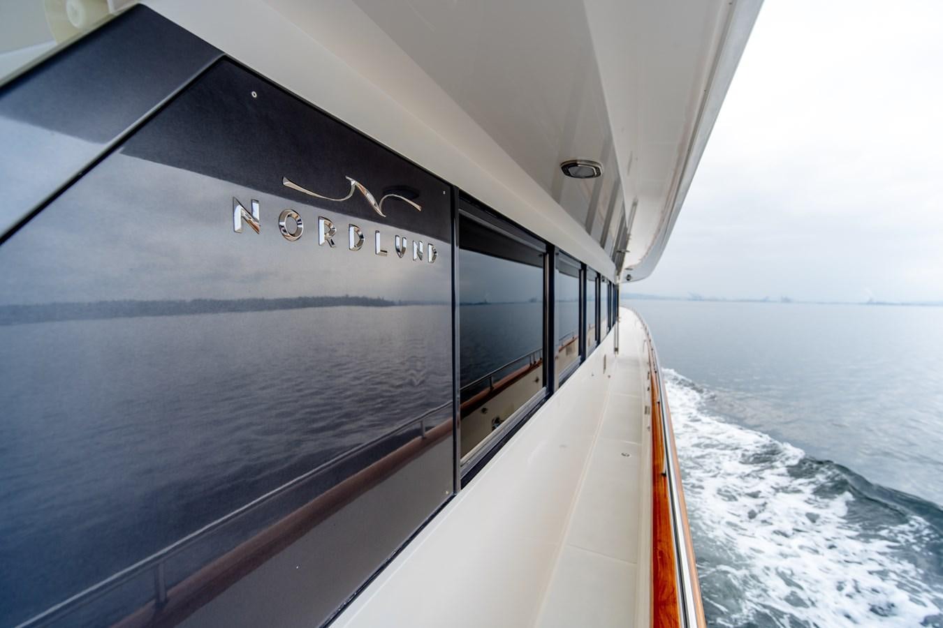 a boat with a sign on the side aboard SHADOWFAX Yacht for Sale