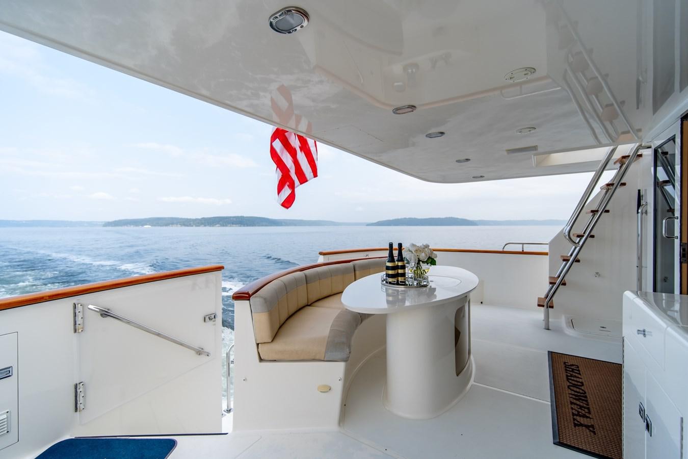 a boat with a table and chairs aboard SHADOWFAX Yacht for Sale
