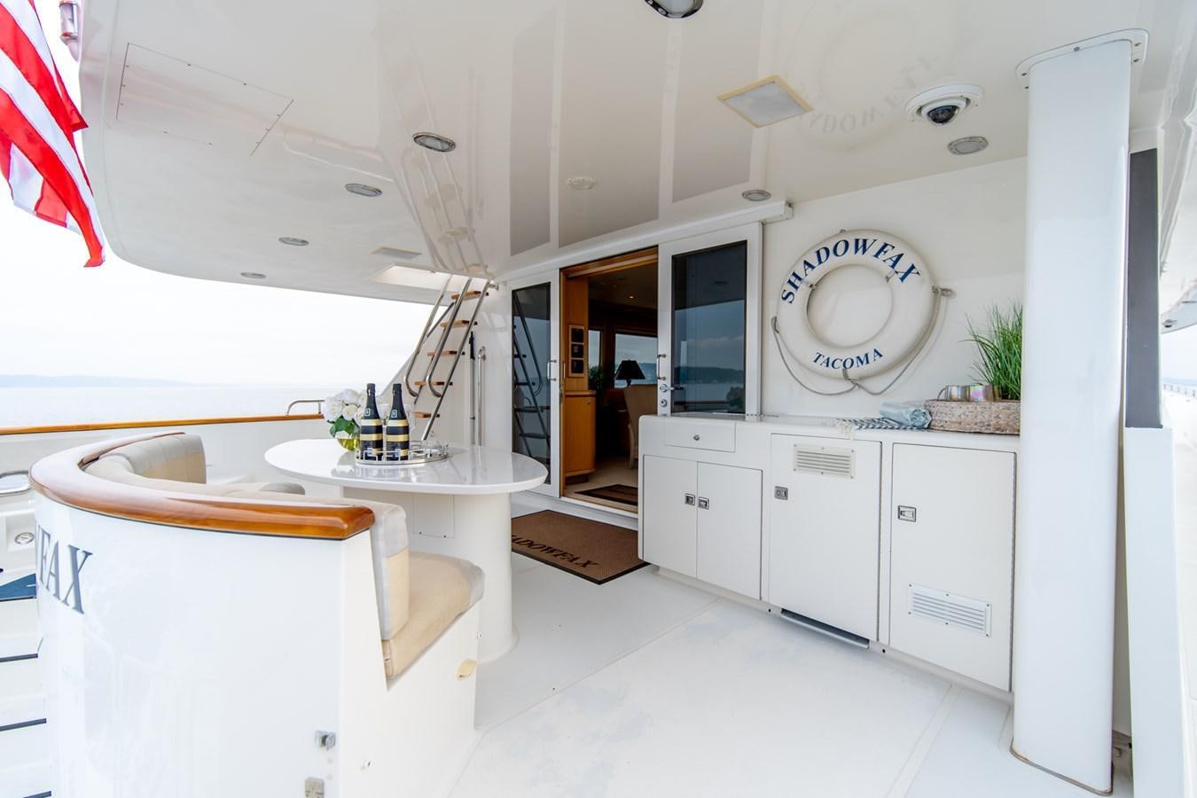 a kitchen with white cabinets aboard SHADOWFAX Yacht for Sale