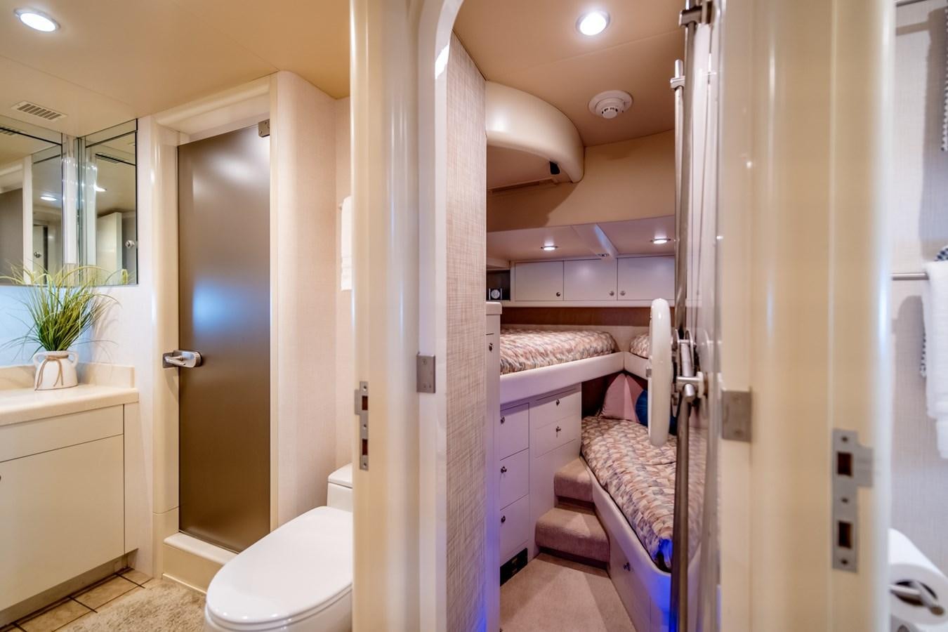 a bathroom with a bed and a sink aboard SHADOWFAX Yacht for Sale