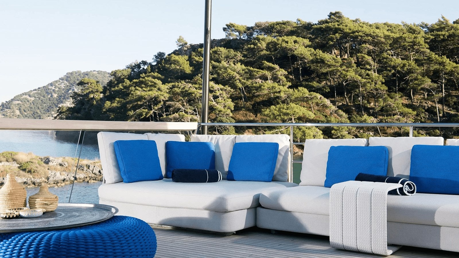 a white couch on a patio aboard 2018 SANLORENZO SL118 #614 Yacht for Sale