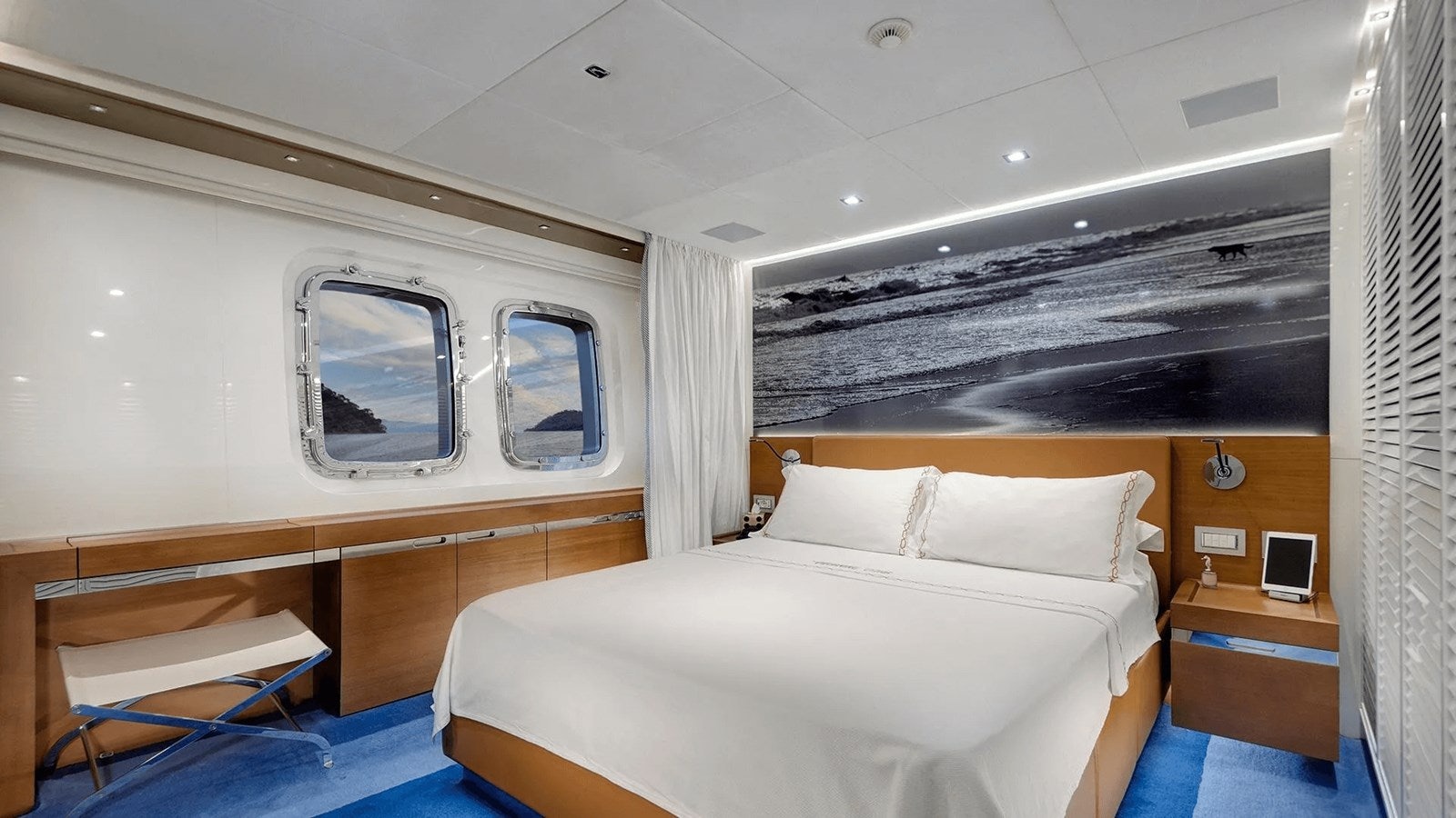 a room with a bed and a window aboard 2018 SANLORENZO SL118 #614 Yacht for Sale