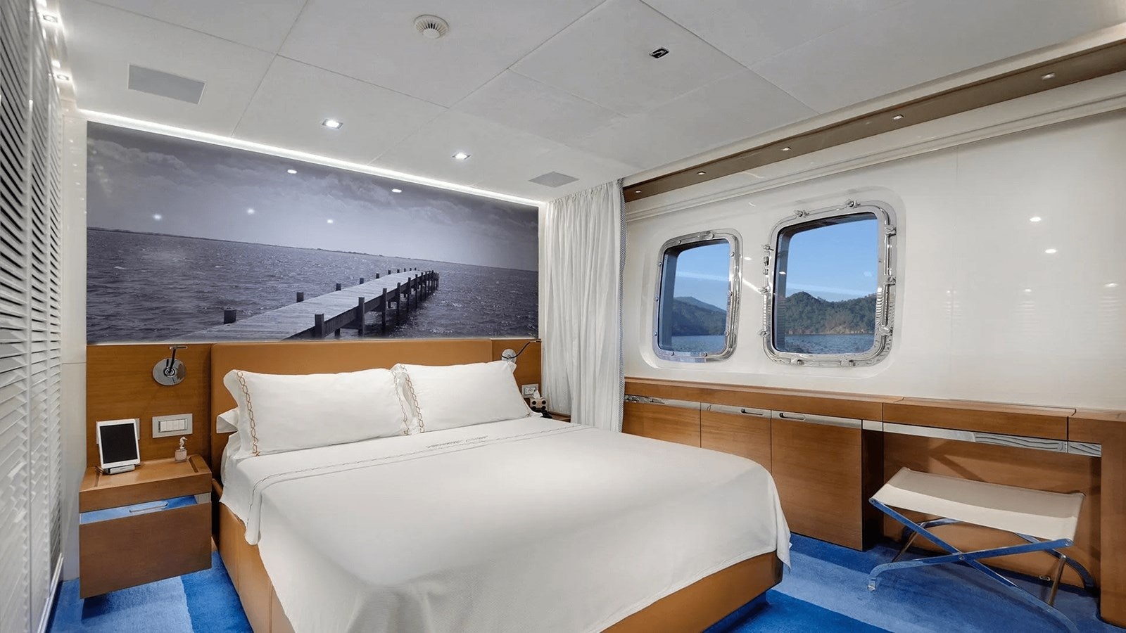 a room with a bed and a window aboard 2018 SANLORENZO SL118 #614 Yacht for Sale