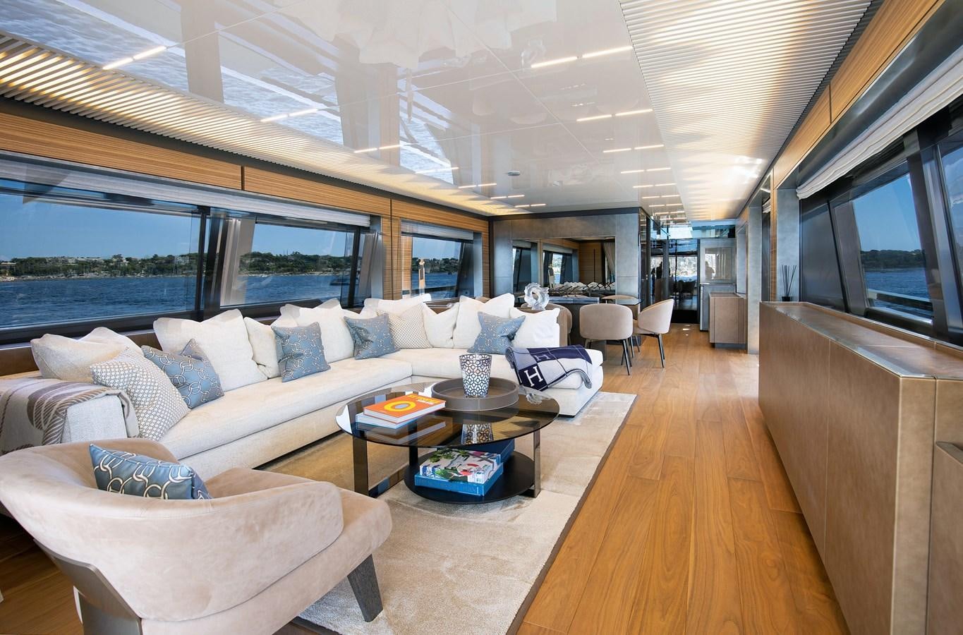 a living room with a large window aboard L'OPERA Yacht for Sale