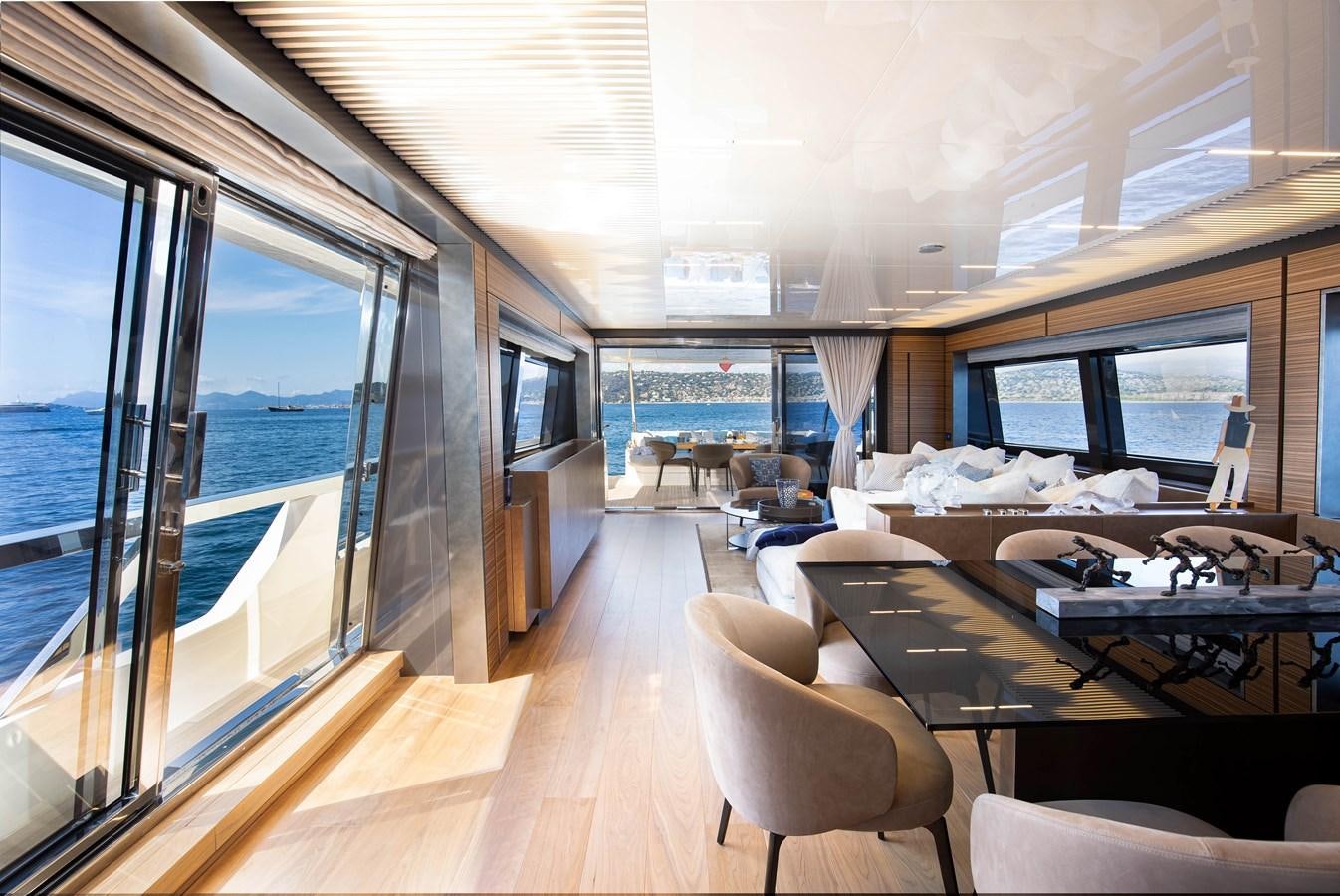 a room with a large window and a view of the ocean aboard L'OPERA Yacht for Sale