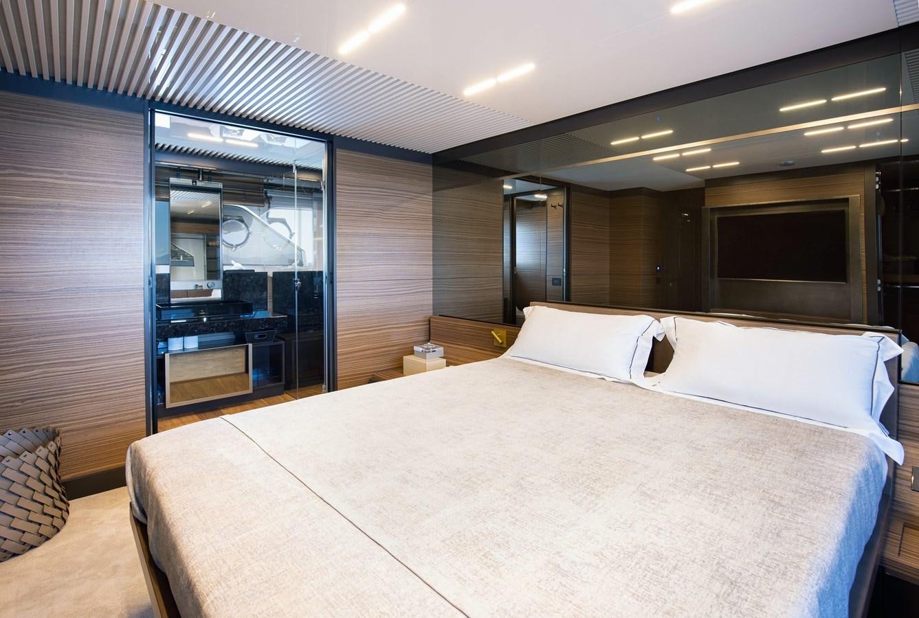 a bed in a room aboard L'OPERA Yacht for Sale