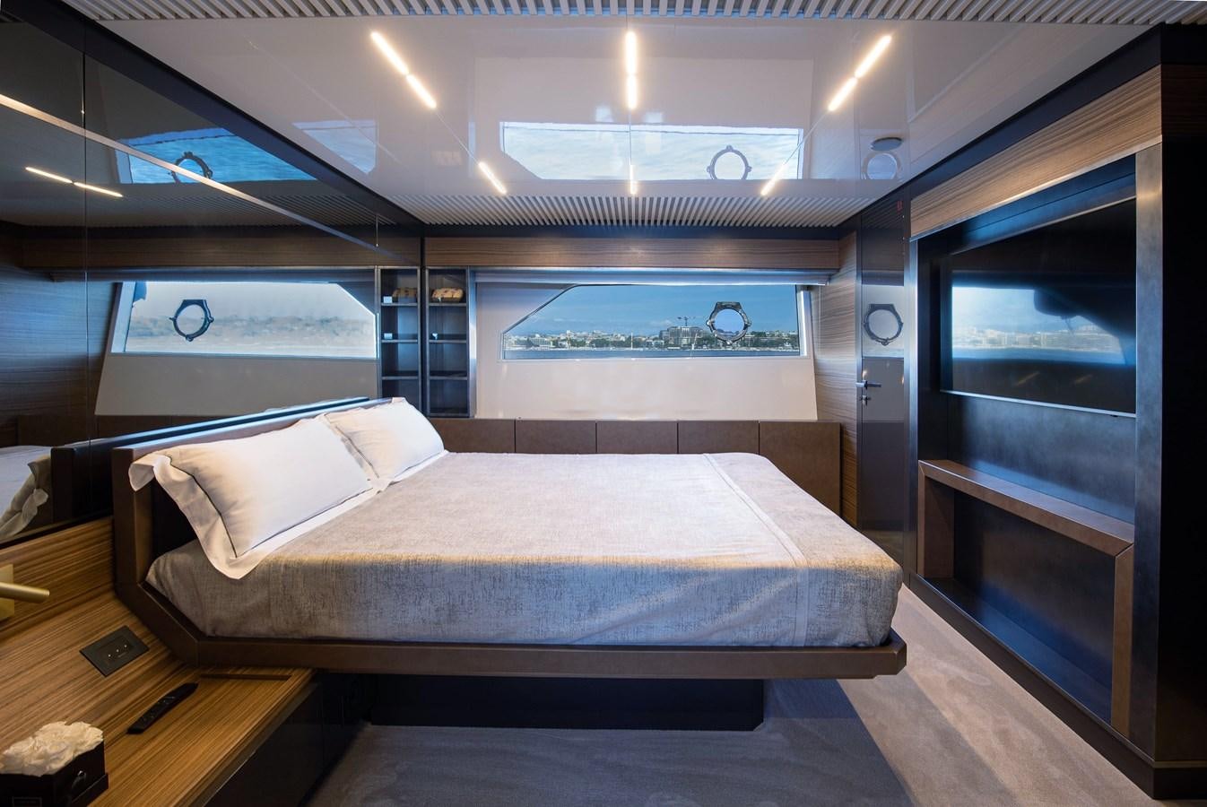 a bed in a room aboard L'OPERA Yacht for Sale