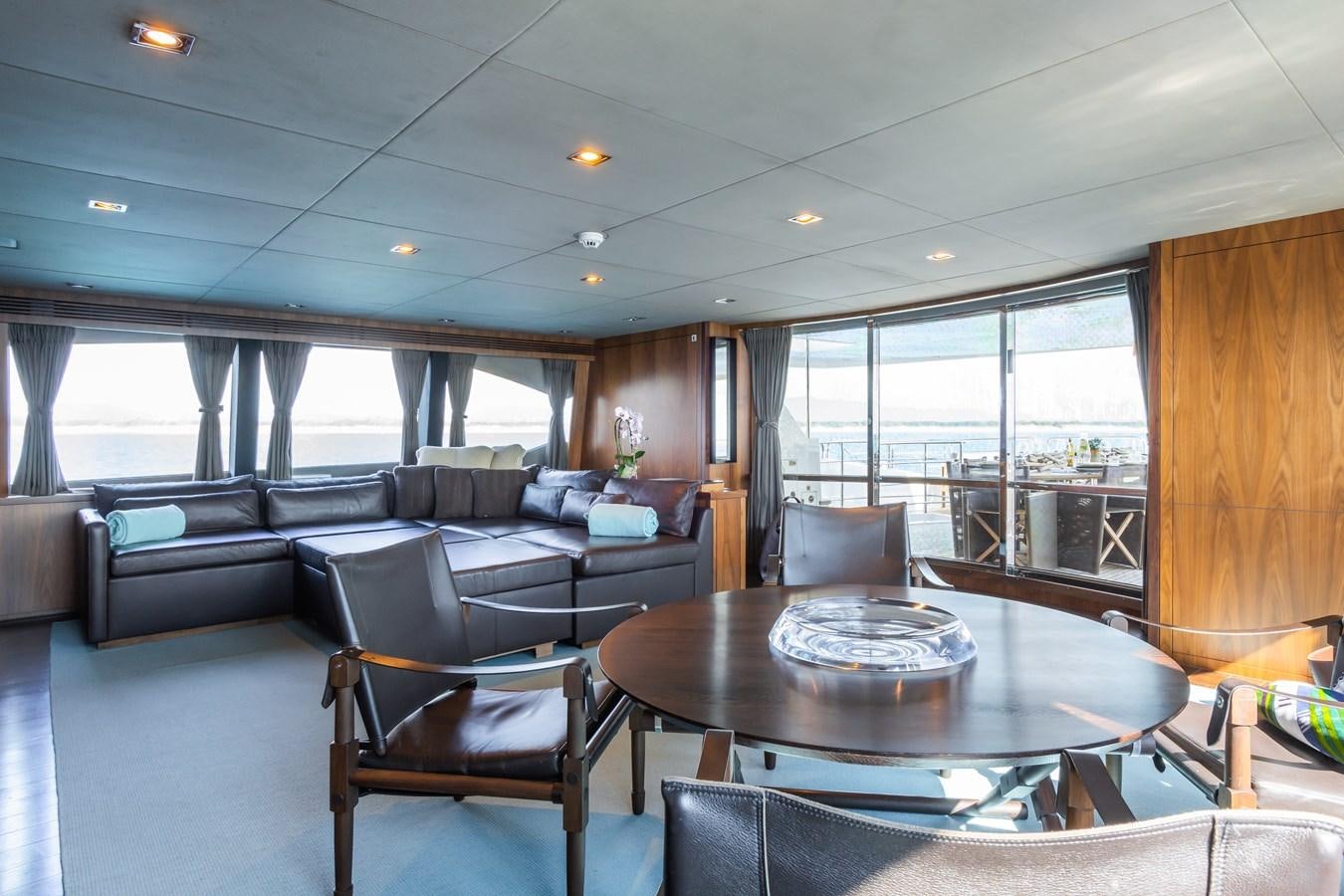 a living room with a couch and a table aboard DESEO Yacht for Sale