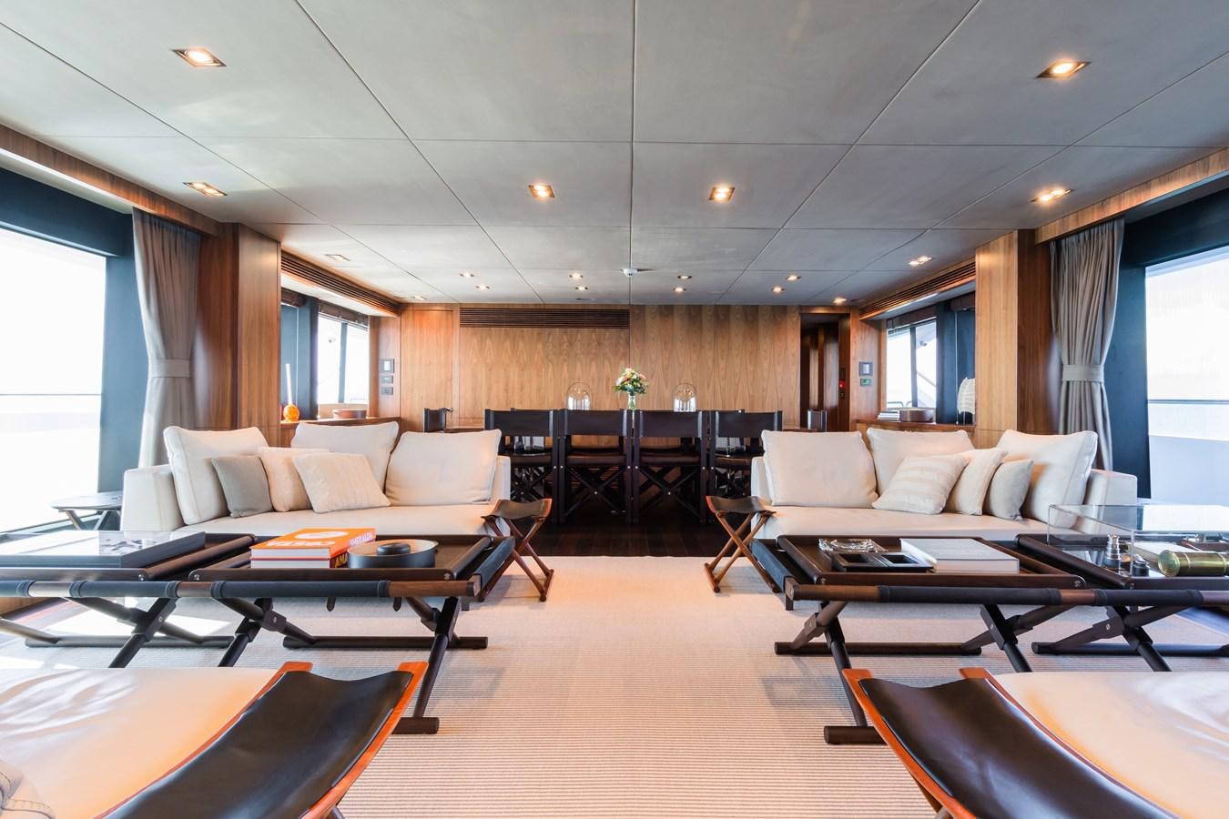 a living room with a couch and a table aboard DESEO Yacht for Sale