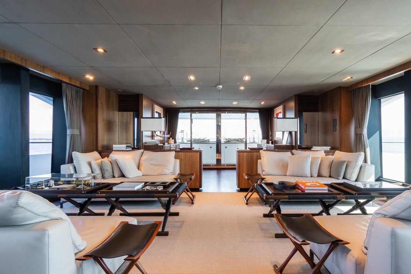 a large living room with a large window aboard DESEO Yacht for Sale