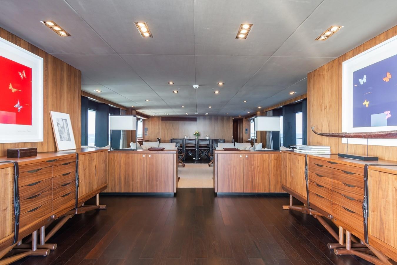 a room with wooden floors and a large window aboard DESEO Yacht for Sale