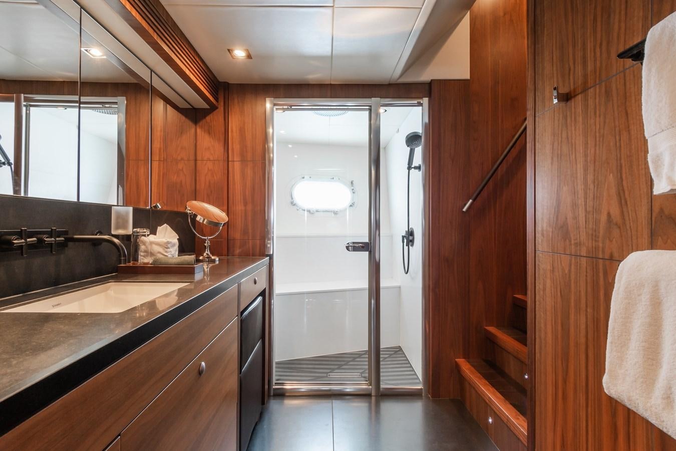 a kitchen with wooden cabinets aboard DESEO Yacht for Sale