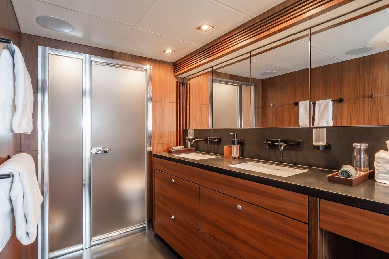 a bathroom with a large mirror aboard DESEO Yacht for Sale