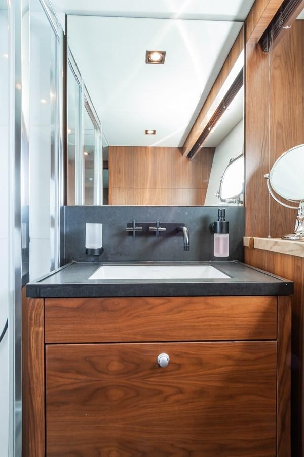 a bathroom with a sink and a mirror aboard DESEO Yacht for Sale