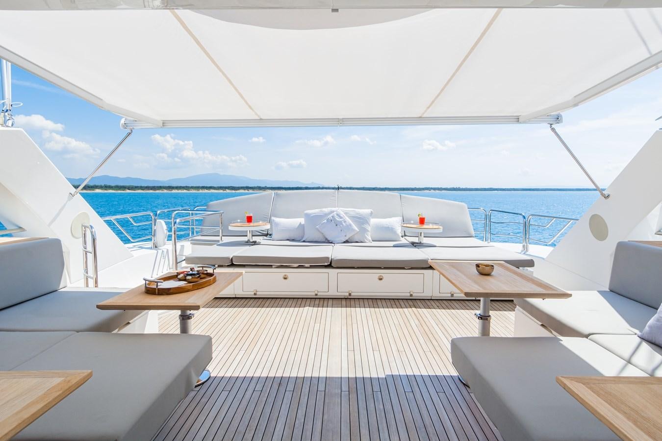 a large white boat with a large deck and a large window aboard DESEO Yacht for Sale