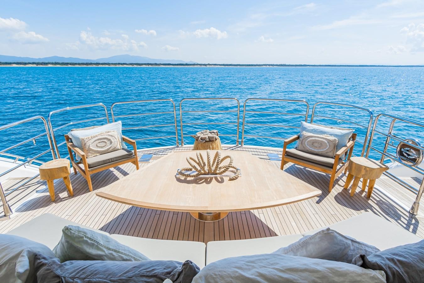 a table set for a dinner on a boat aboard DESEO Yacht for Sale