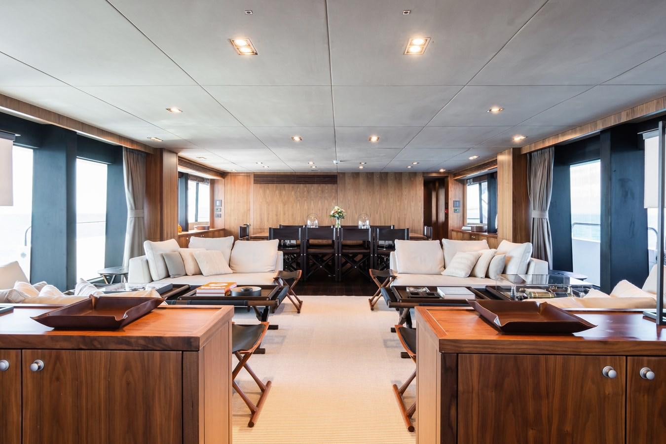 a room with a couch and a table aboard DESEO Yacht for Sale