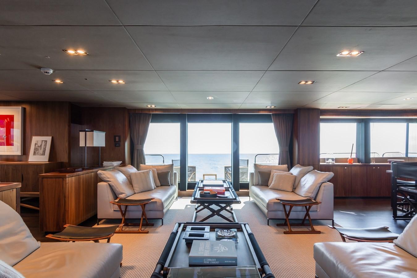 a living room with a large window aboard DESEO Yacht for Sale