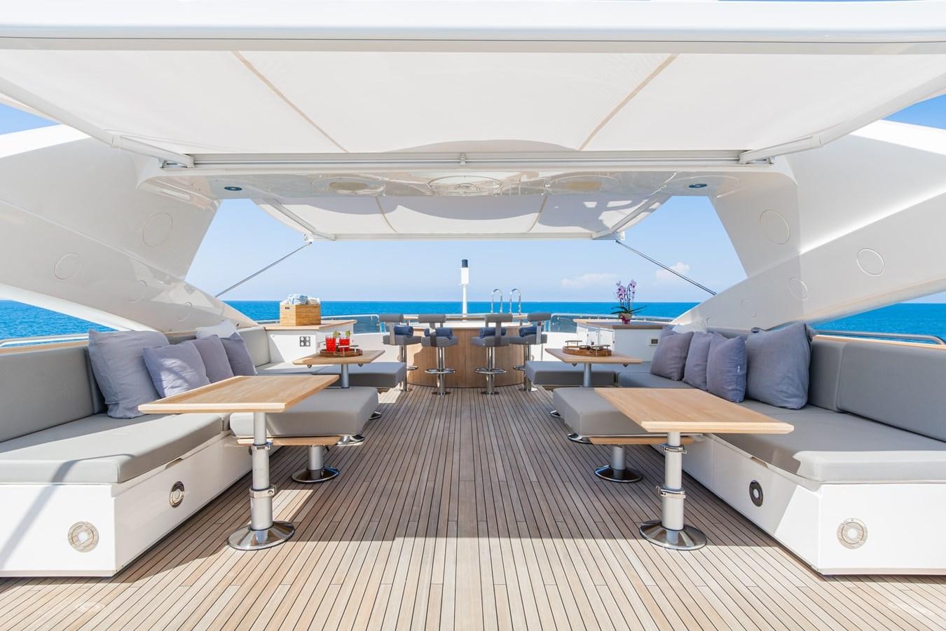 a room with a pool table and couches aboard DESEO Yacht for Sale